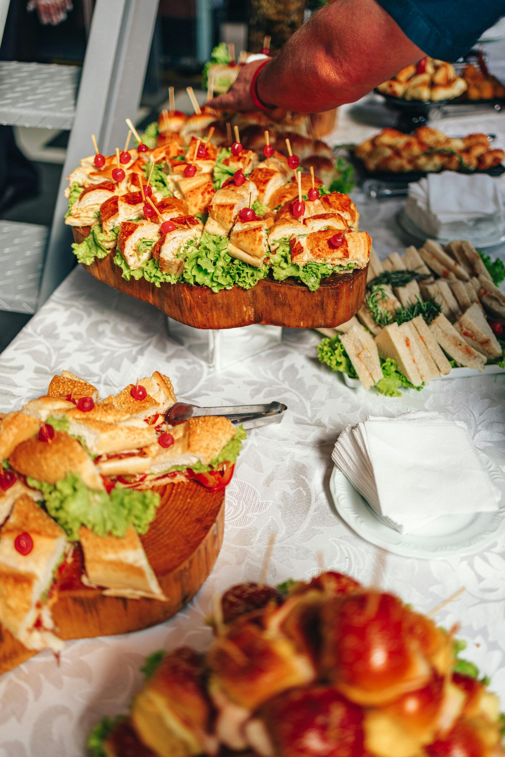 A well-presented event catering buffet table with sandwiches and canapes, representing the importance of inclusive and allergen-aware food provision at events